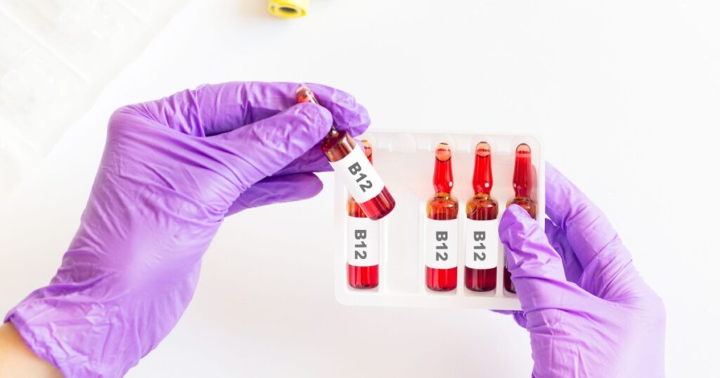 Set of glass ampules for syringe, woman hands holding