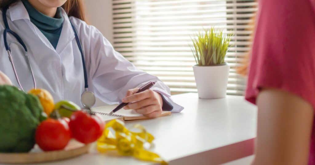 Panoramic banner. Nutritional. friendly nutritionist female doctor medical talking about diet plan with vegetable to young patient in office hospital, nutrition, food science, healthy food concept