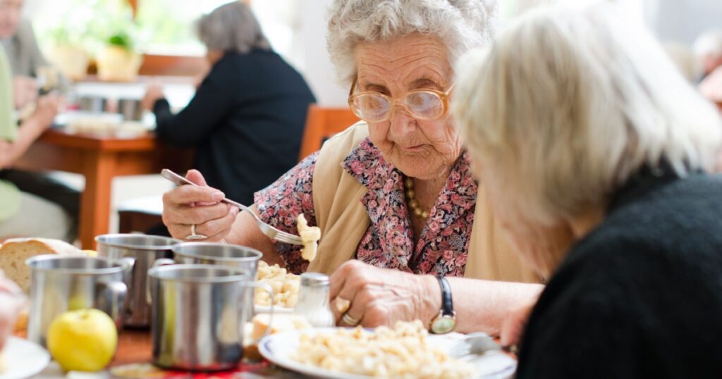 senior woman eating her lunch at home