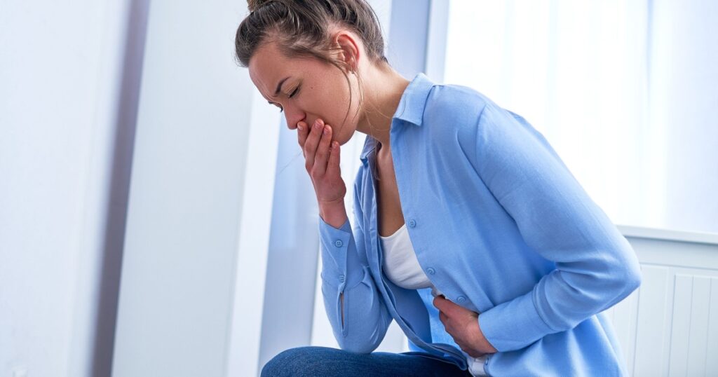 Female suffers from nausea and vomiting due to digestive and stomach illness problems and gastrointestinal system diseases or food poisoning. Morning toxicosis in first trimester of pregnancy