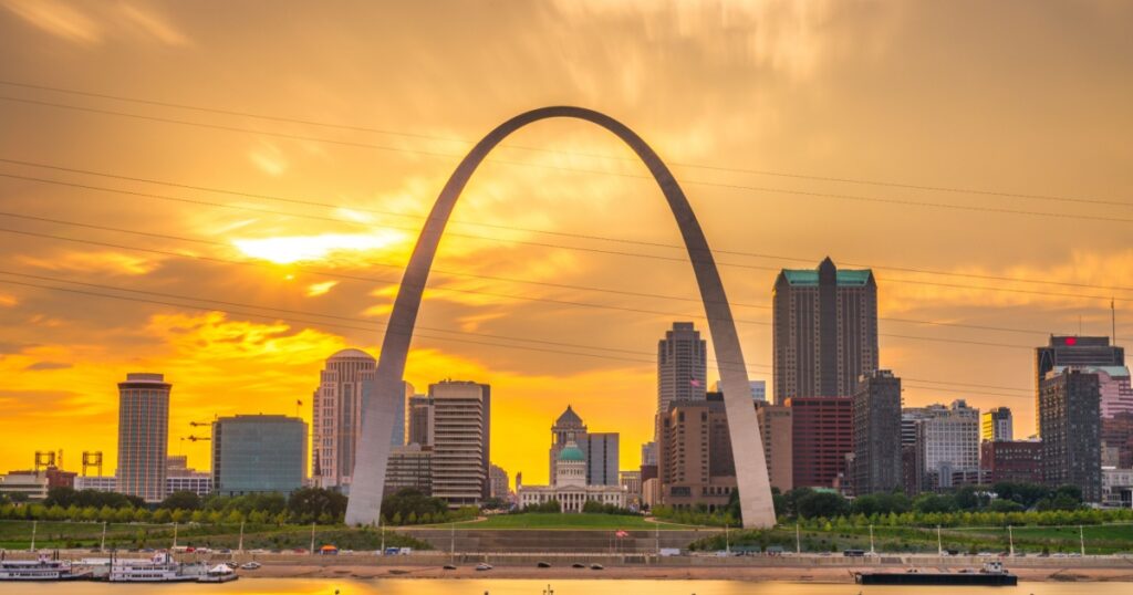 St. Louis, Missouri, USA downtown cityscape on the Mississippi River at sunset.