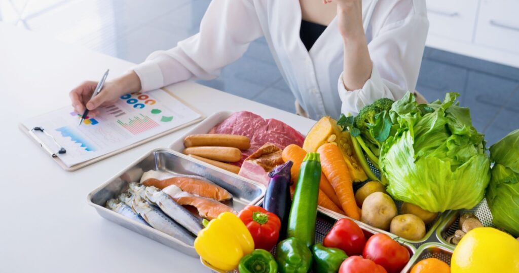 Young woman and foodstuff. Food coordinator. Nutritionist.
