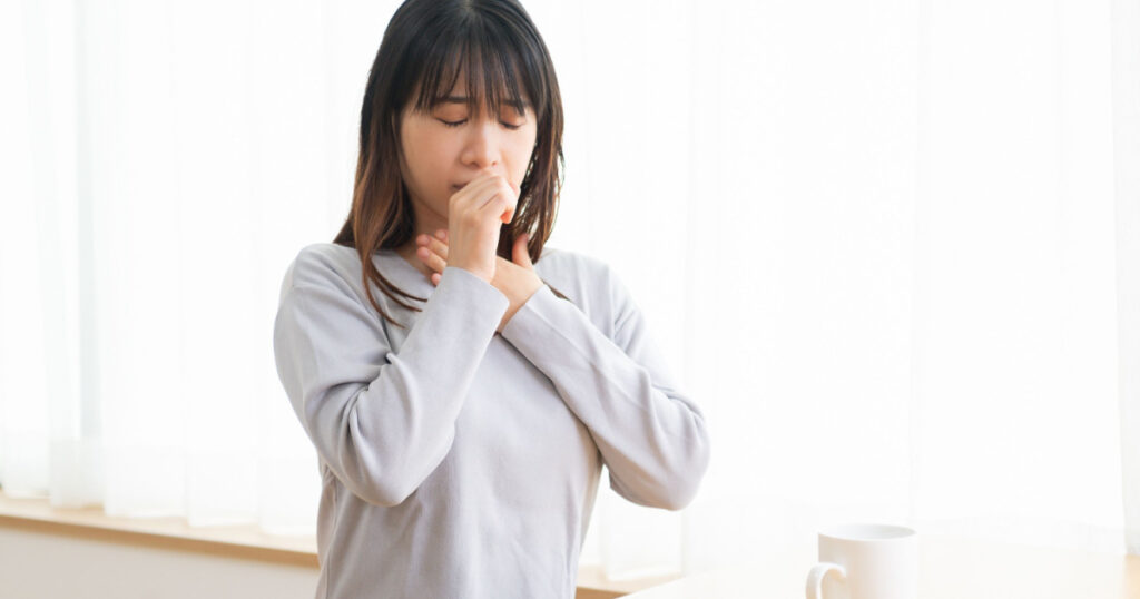 Young woman with a sore throat taken in the studio