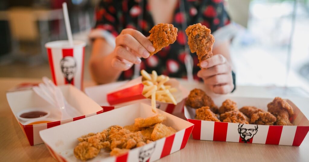 KFC is popular fast food chain known as Kentucky Fried Chicken.background of KFC restaurant.selective focus.THAILAND,20 May 2021.
