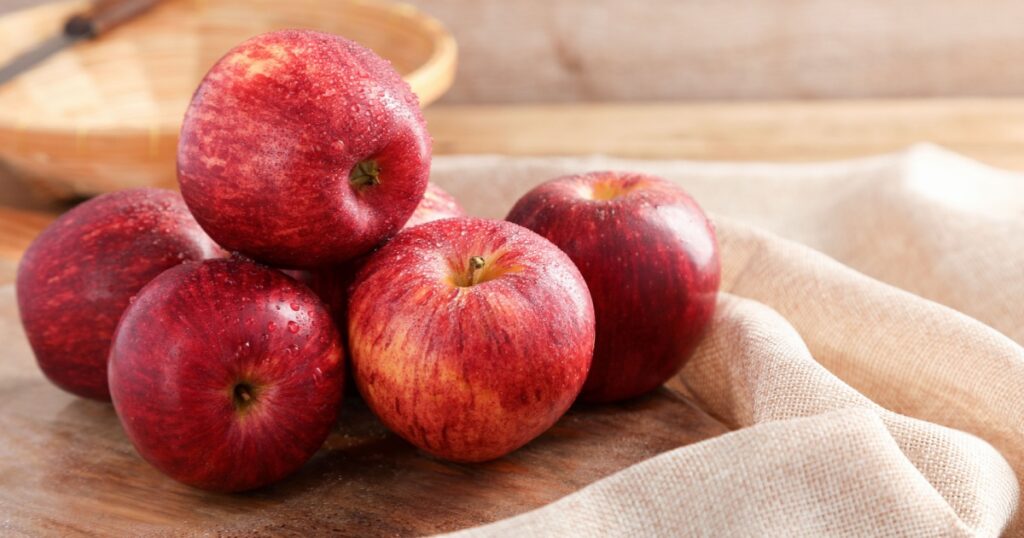Group of Gala Apple on wooden board background, Fruits concept.
