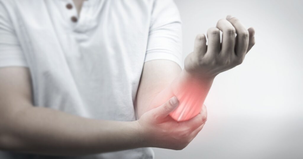 Muscle pain, arm pain, burning sensation, weak muscles, Office syndrome, Muscle tear caused by exercise, red inflamed zone. man having arm pain on a gray background. concept of health care