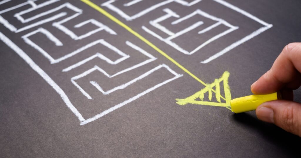 Hand draw a shorten straight way to go through the complication of a maze game, easier process, simplify in communication, or fast solution concept