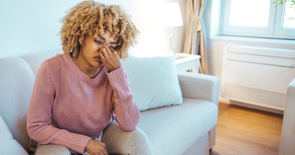 Health And Pain. Stressed Exhausted Young black Woman Having Strong Tension Headache. Closeup Portrait Of Beautiful Sick Girl Suffering From Head Migraine, Feeling Pressure And Stress.
