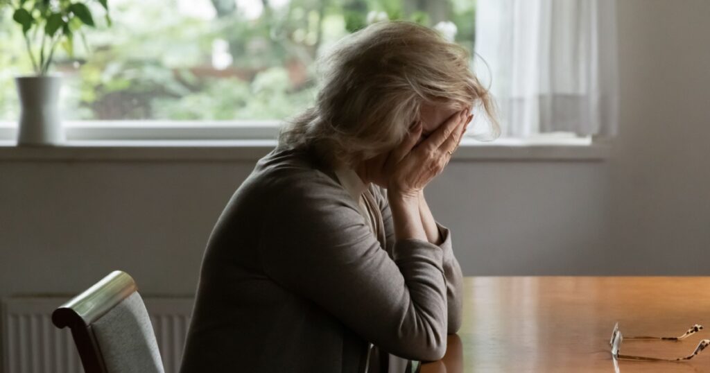 Unhappy old Caucasian woman
