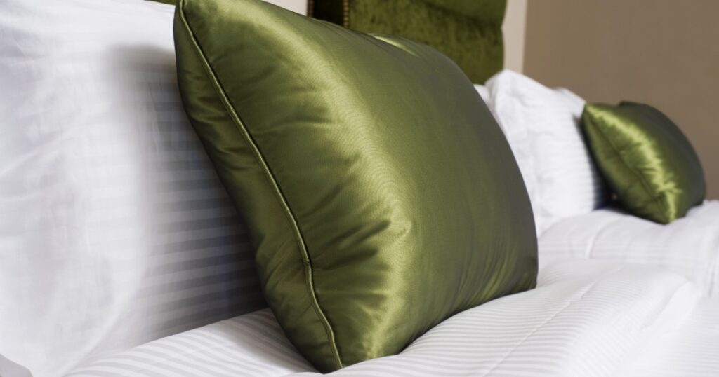 Cushions , Green pillows on bed