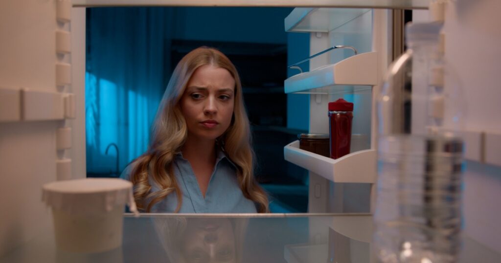 Point of view POV inside refrigerator Caucasian girl hungry woman open fridge at home kitchen look at empty shelves order food products delivery with mobile phone app online service web store