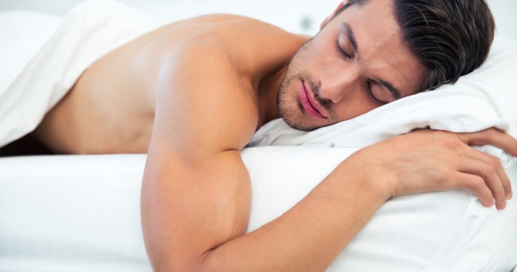 Portrait of a man sleeping in the bed at home