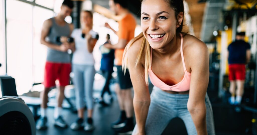 Close up image of attractive fit woman in gym