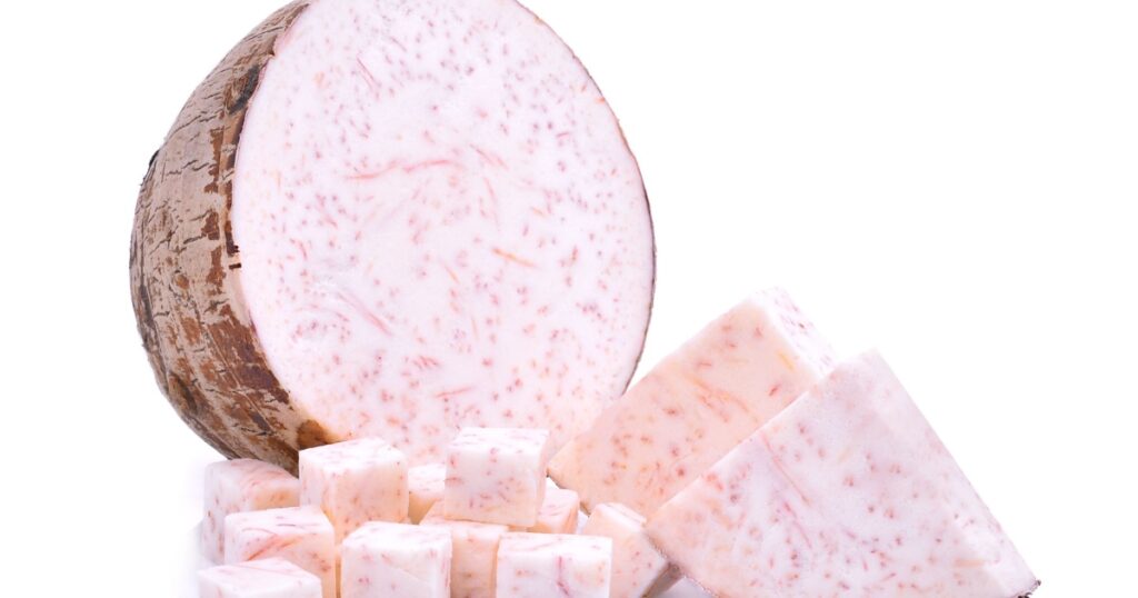 half and slice with cubes of taro root isolated on white background