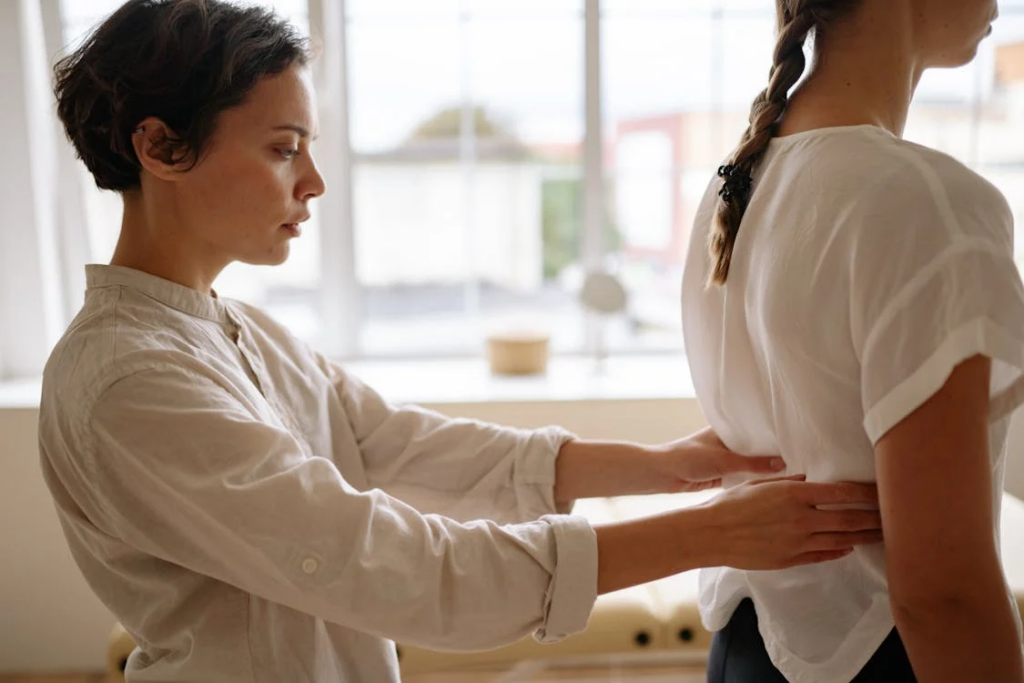 cancer -woman examining back