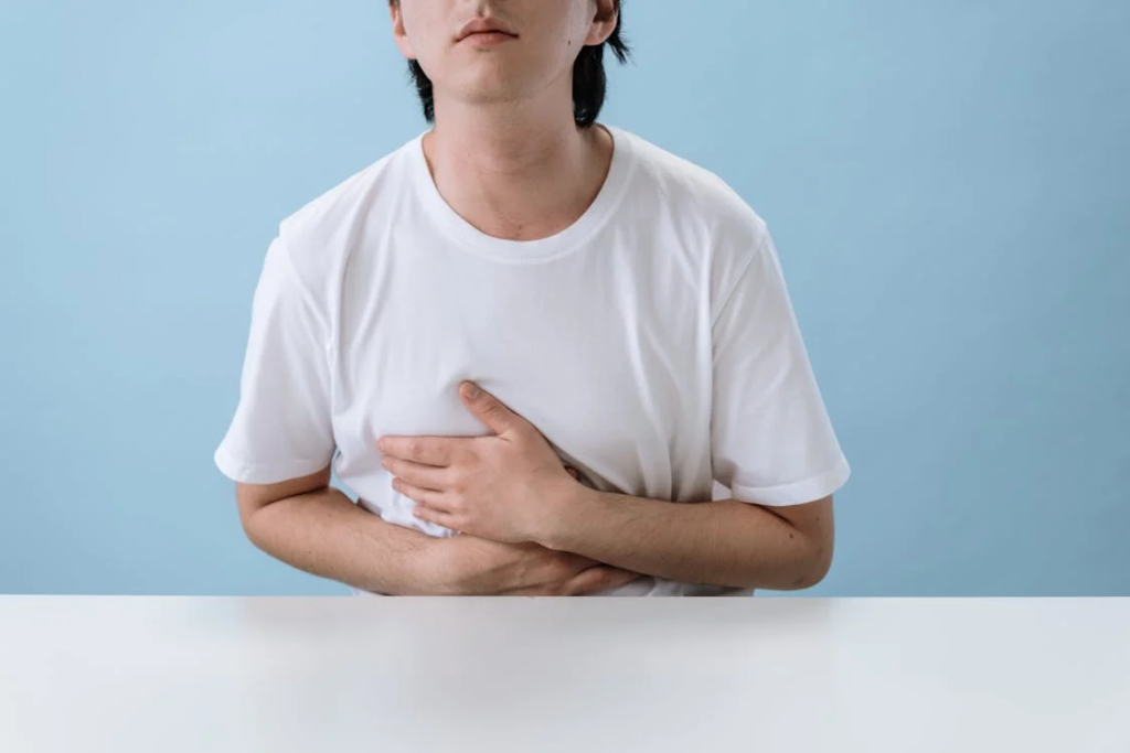 man with abdominal discomfort and breathing difficulties