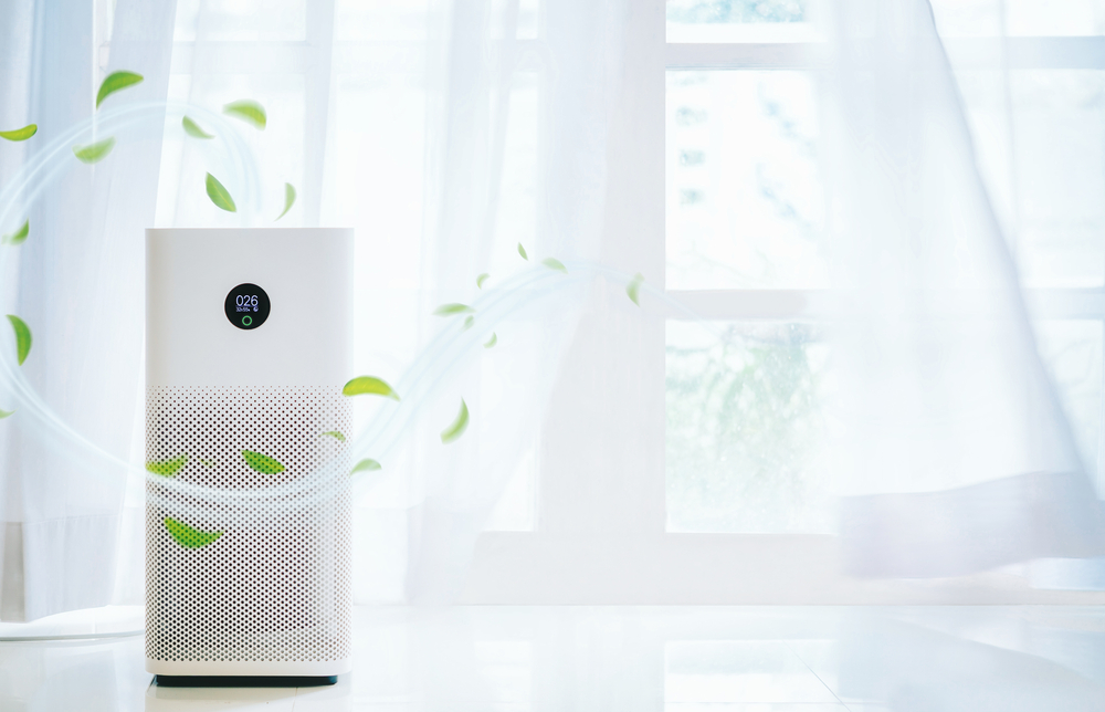 air purifier a living room, air cleaner removing fine dust in house. protect PM 2.5 dust and air pollution concept