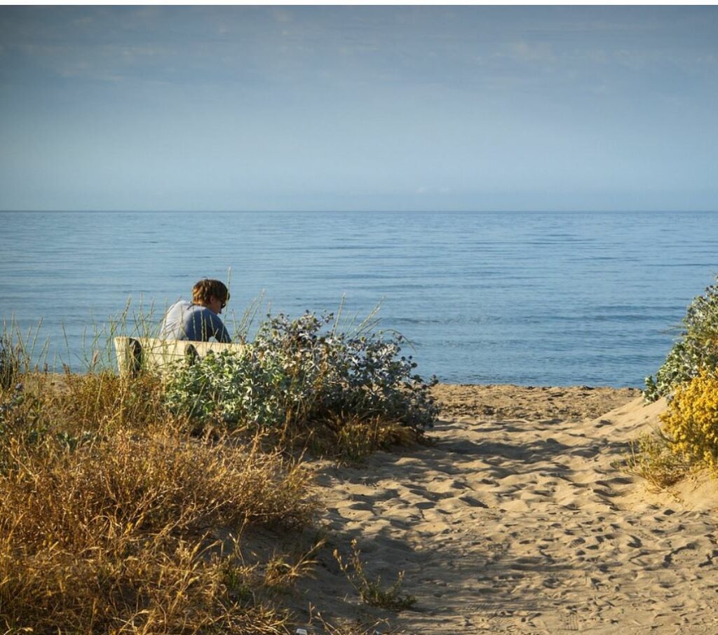 Person being alone at the beach.