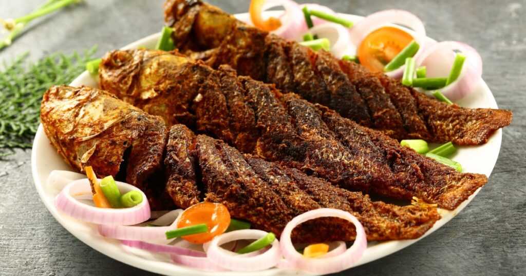 Homemade crispy fried mullet fish with spices - Asian cuisine.
