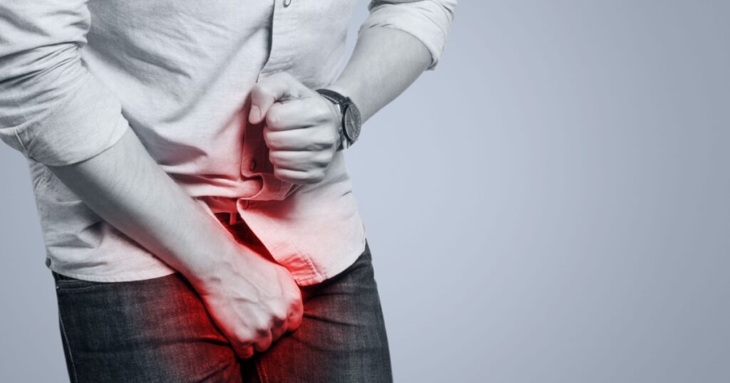 Man feeling a pain in his groin