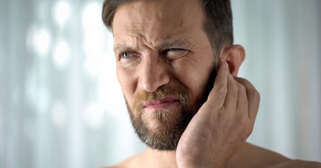 Sick guy feeling ear pain, health care, neurological infection, itchiness otitis