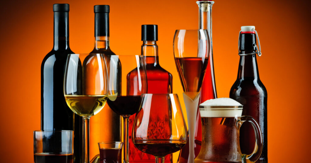 still life with various glasses and bottles of alcohol
