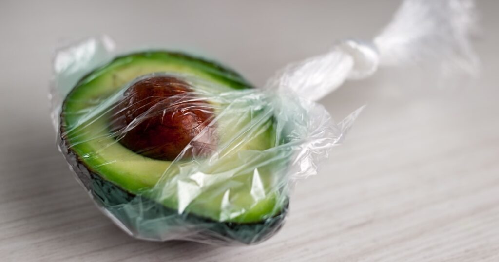 Half of avocado packed in a plastic bag