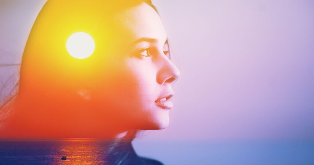Human soul energy power spirit, inner peace, mental health therapy feel help gut care concept. abstract art portrait of happy woman head face side portrait look at sun sea nature sunrise sunset in sky