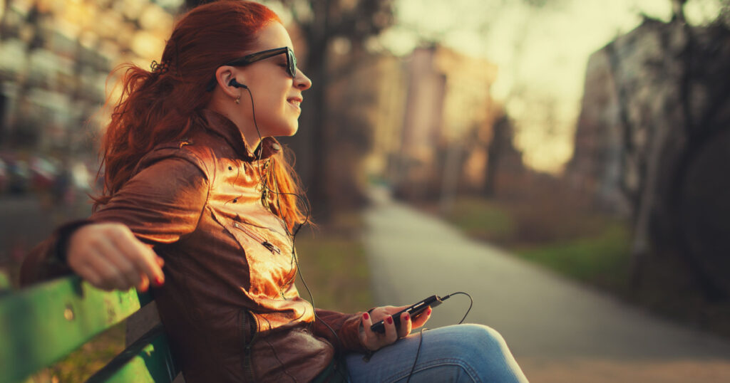 Young woman using a smart phone outdoors