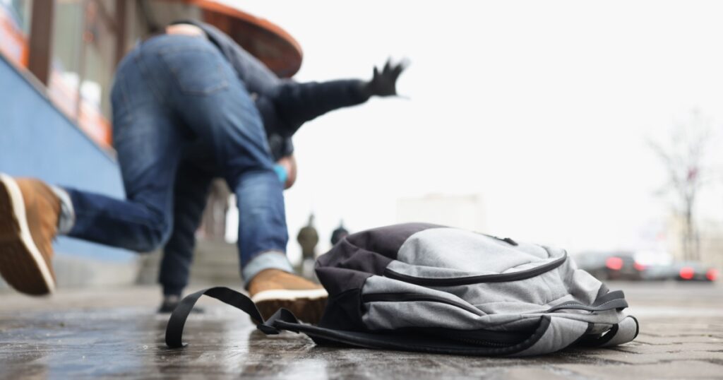 Person get injury after falling on slippery ground in winter season