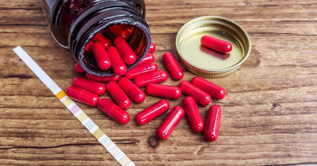 Cranberry pills with d mannose and urine test strip to prevent cystitis and urinary tract infections