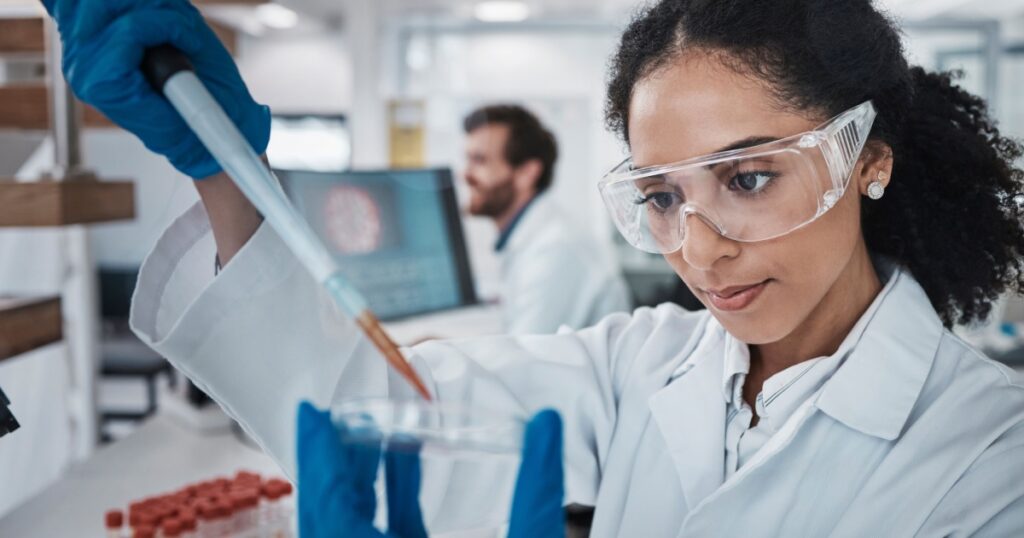 Scientist, pipette or petri dish in laboratory research, medical pharmacy or dna blood engineering. Black woman, dropper or science equipment in healthcare analytics test or future vaccine innovation