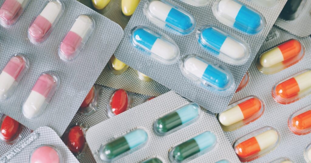 close up pharmaceuticals antibiotics pills medicine in blister packs. colorful antibacterials pills Pharmacy background. capsule pill medicine Antimicrobial drug resistance. Pharmaceutical industry