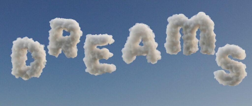 The word "dreams" in clouds. Blue sky in the background.