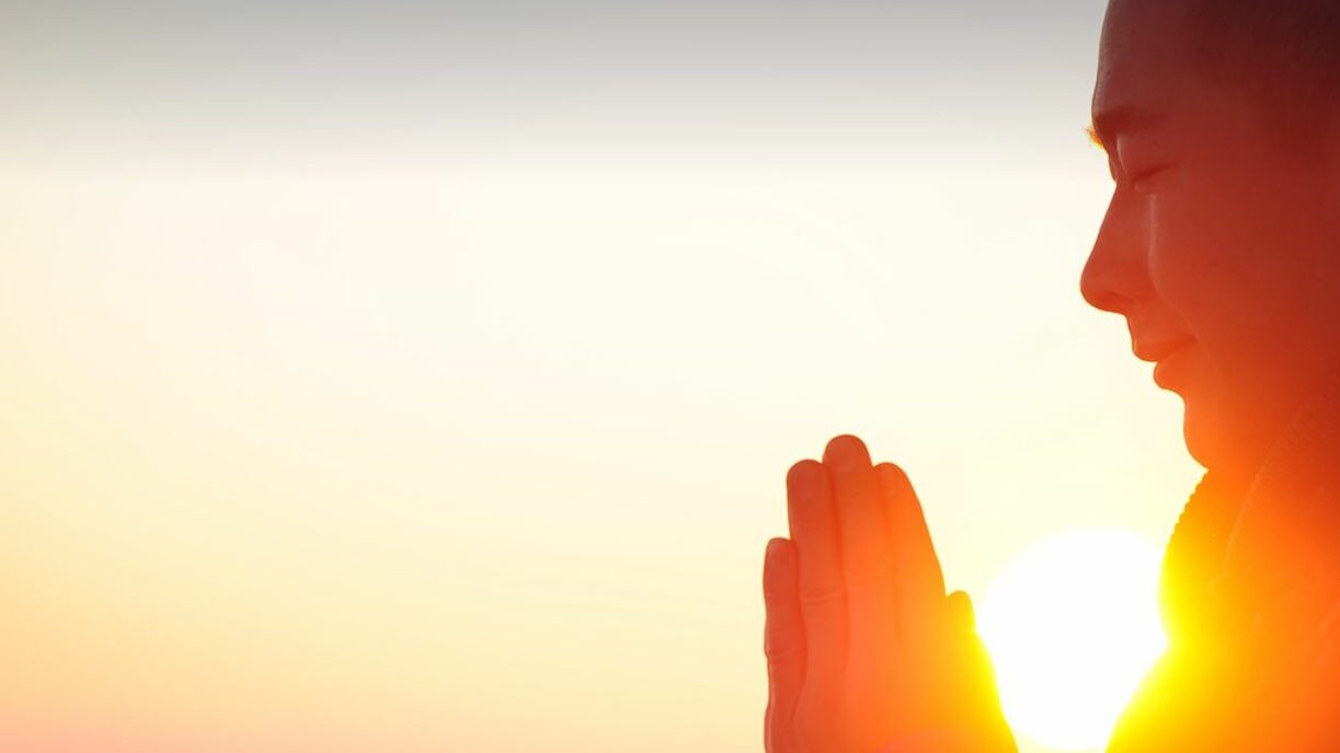 Meditating in front of the glowing Sun.