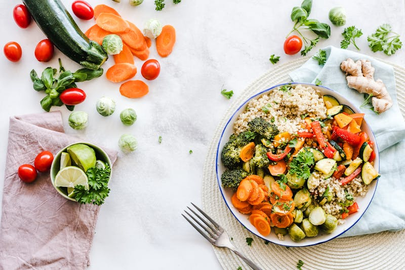 healthy foods and a plate full of vegetable and quinoa