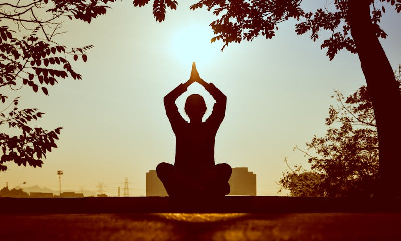 hands raised in meditation