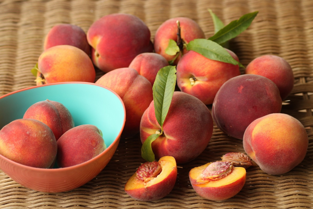 peaches in a bowl and sliced open