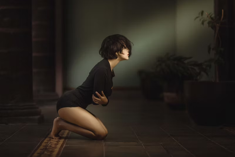 a woman bent over with stomach issues