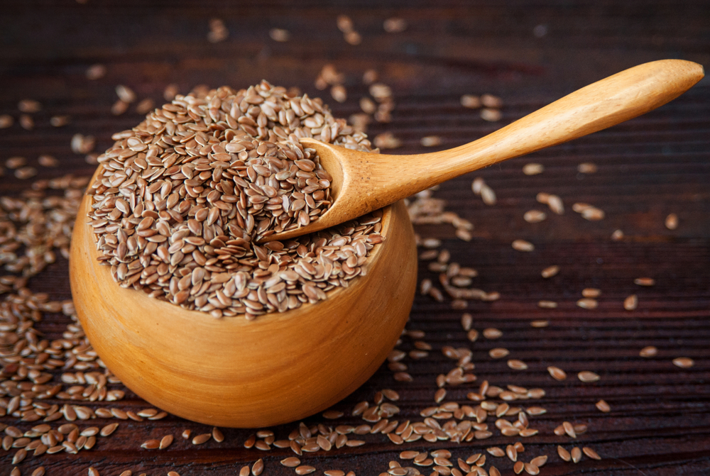 Wooden bowl with flax seeds

