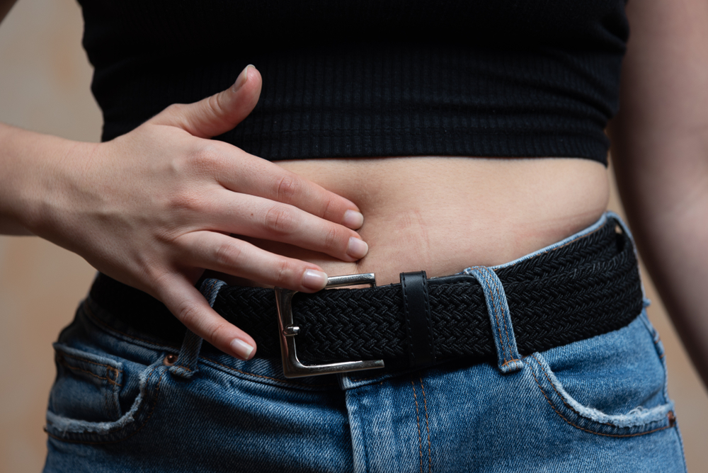 abdominal swelling, cramps, and pains in the premenstrual syndrome and during menstruation