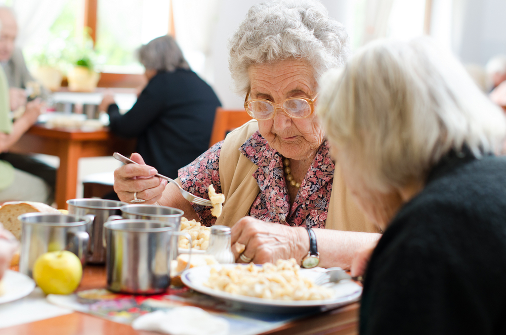 senior woman eating her lunch at home