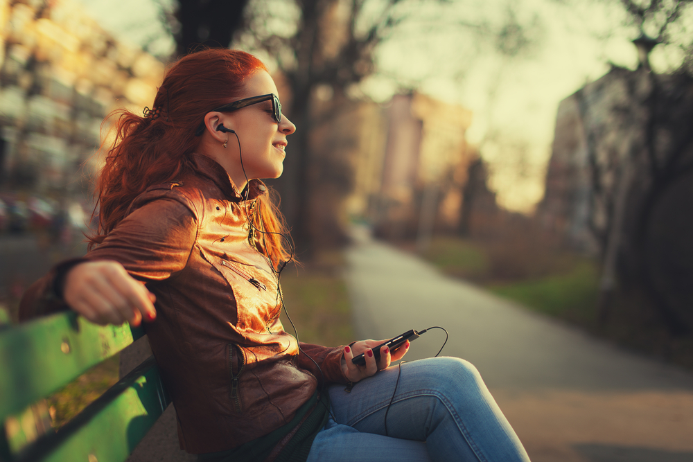 Young woman using a smart phone outdoors