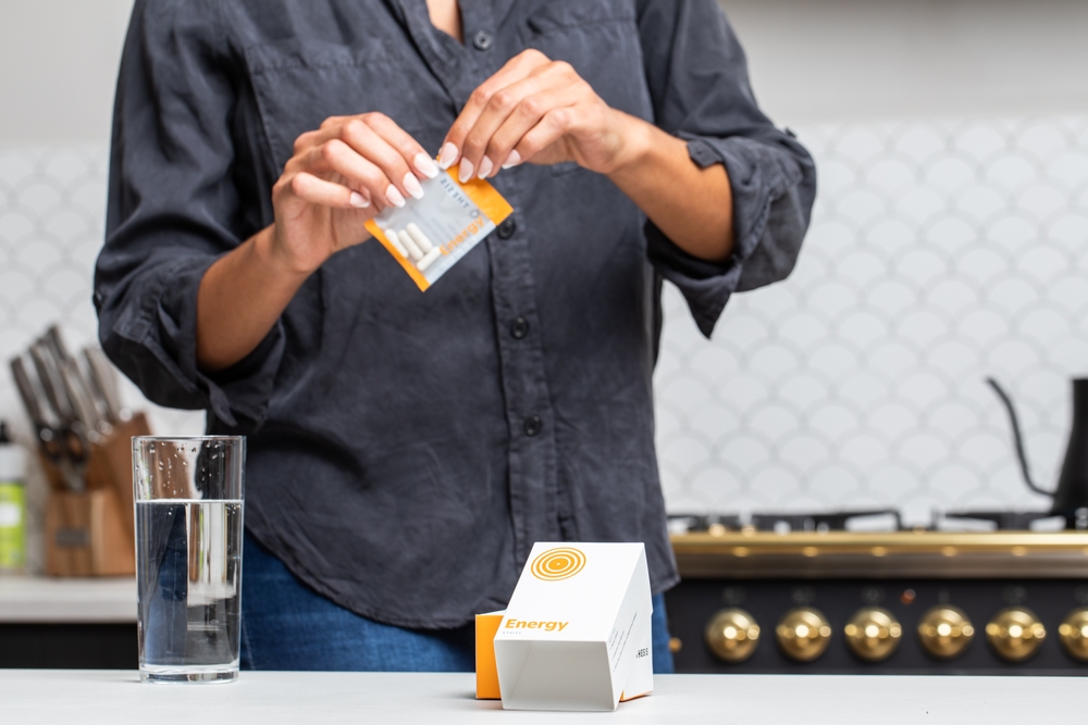 Opening pack of nootropics supplements in kitchen