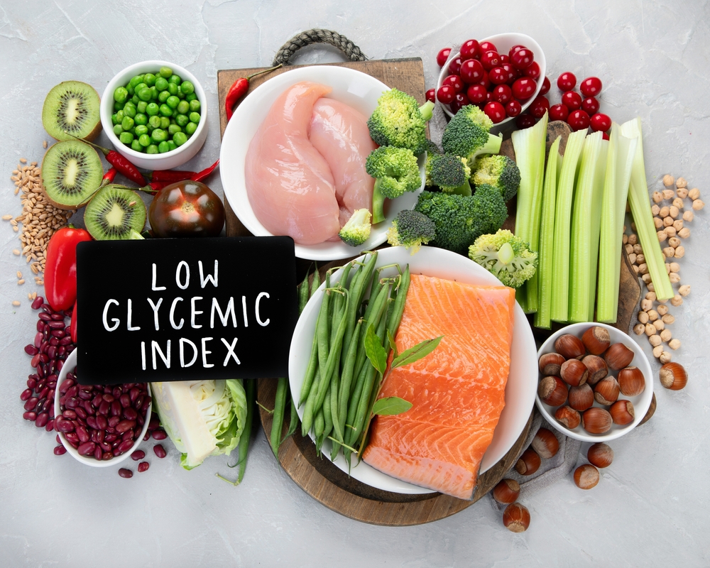 Foods with low glycemic index on gray background. Healthy food concept. Top view, flat lay
