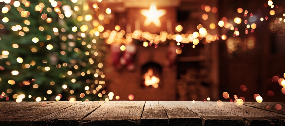 Christmas Tree With Illumination Near the Fireplace. Home Decor