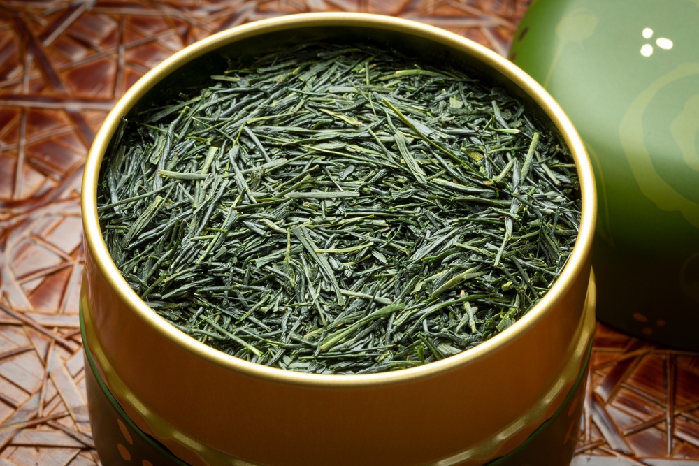 High quality Japanese Gyokuro sencha dried tea leaves close up in a tea tin
