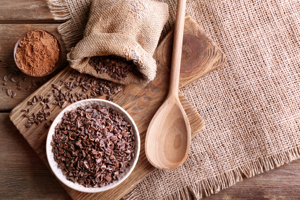 Composition with cocoa nibs on table
