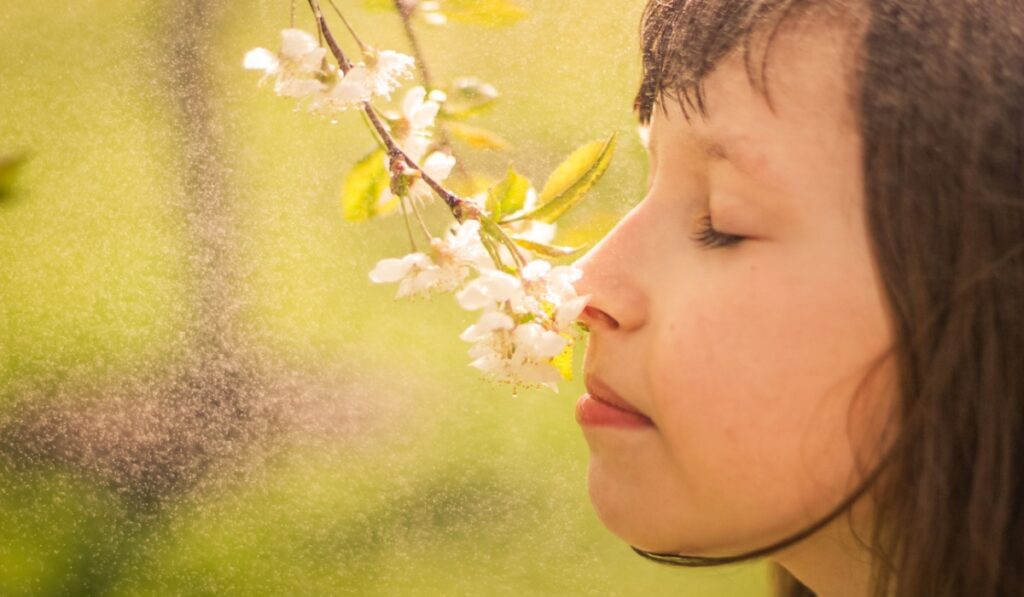 woman smelling flower