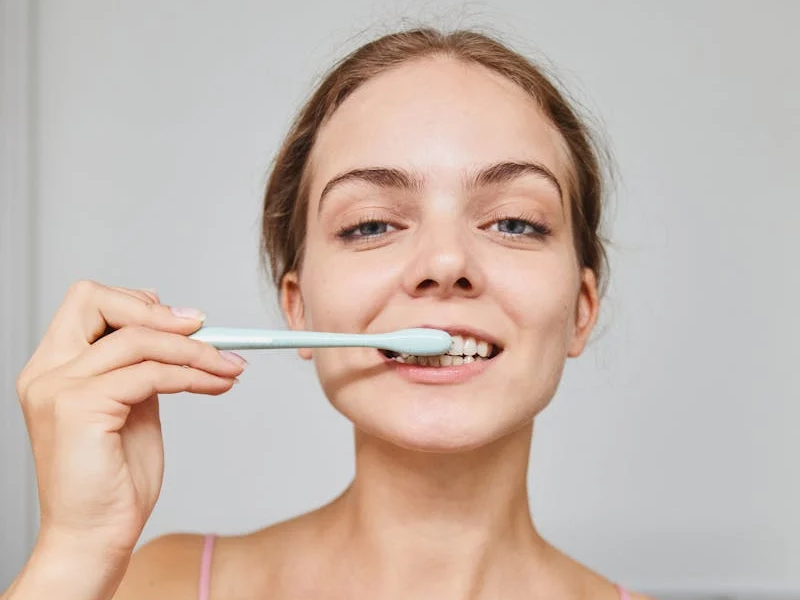 Woman brushing her teeth